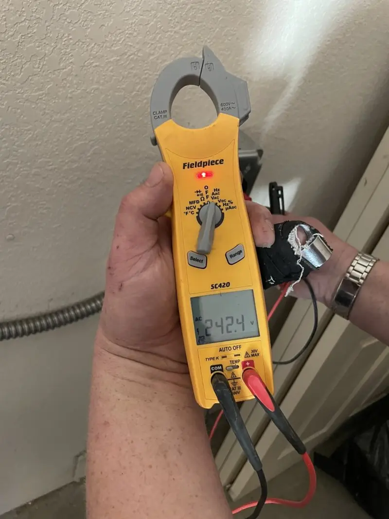 Voltage testing with clamp meter during Electrical Installation Services in Pontiac